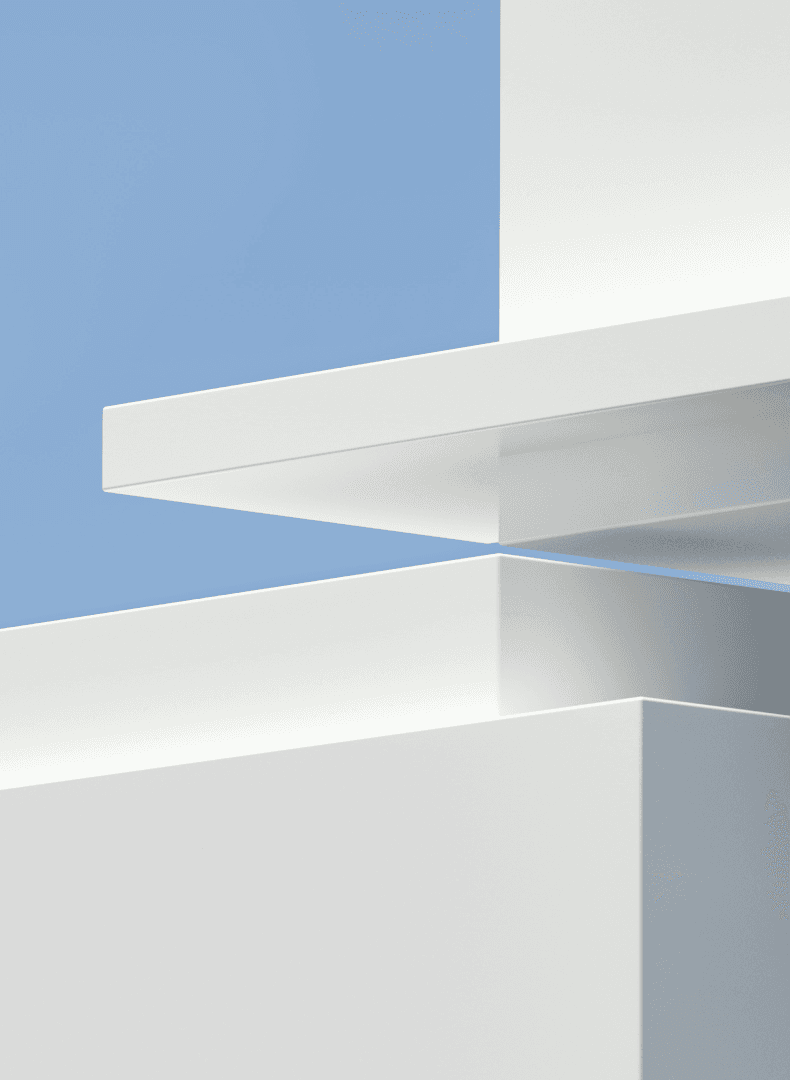 Abstract 3D render of white rectangular blocks and slabs stacked against a pale blue sky